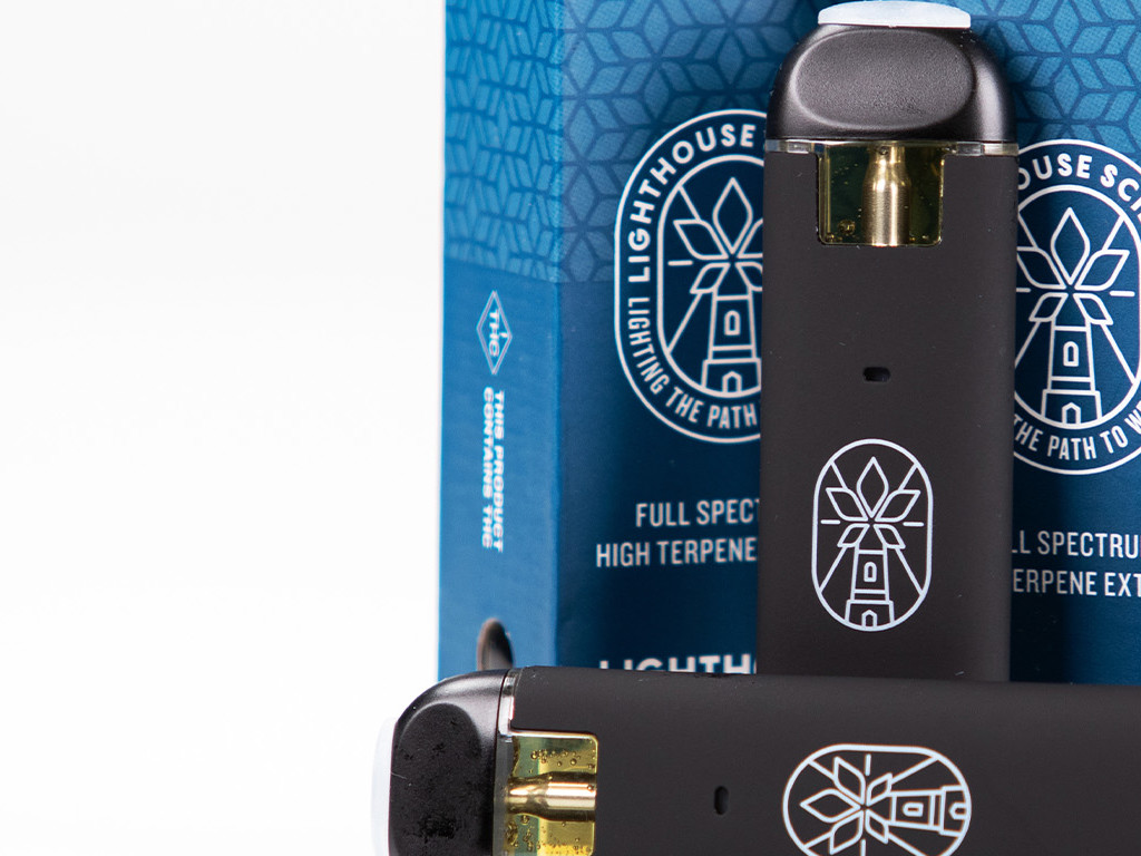 Two Lighthouse Sciences Vapes in front of product package